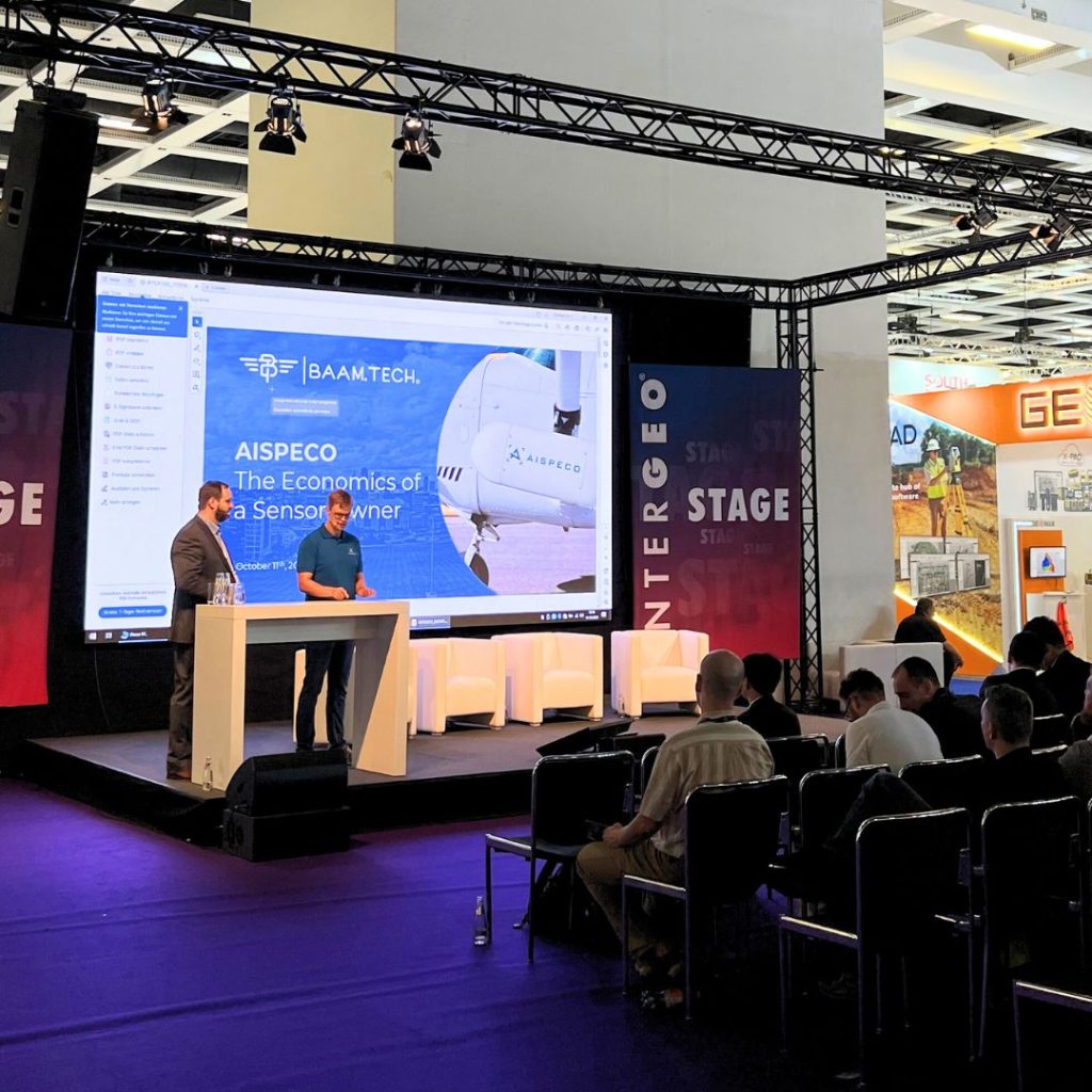 AISPECO CEO Mantas Vaskela and Jared E. Martin from BAAM.Tech delivering a seminar "The Economics of a Sensor Owner" at INTERGEO Expo and Conference 2023.